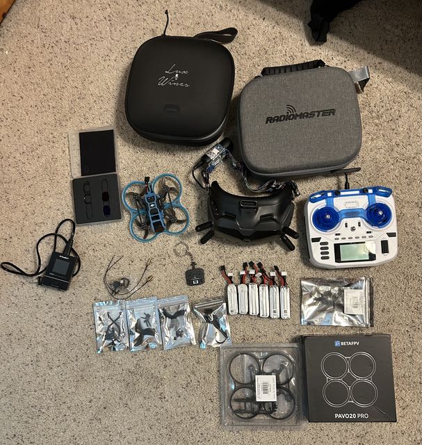 Pavo20 with goggles, radio, batteries, and chargers