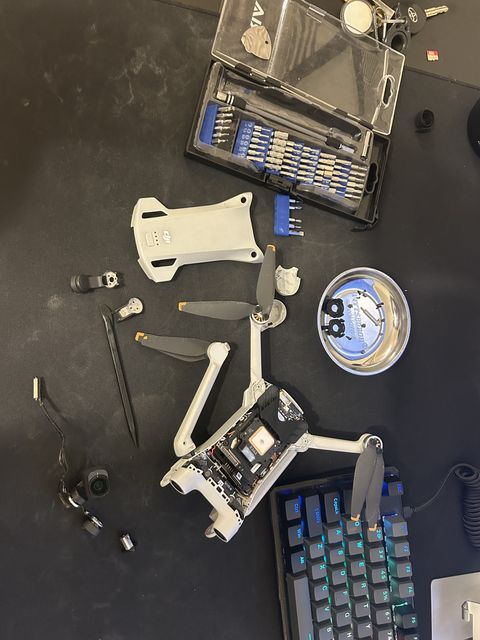 DJI Mini 3 Pro disassembled on a workbench