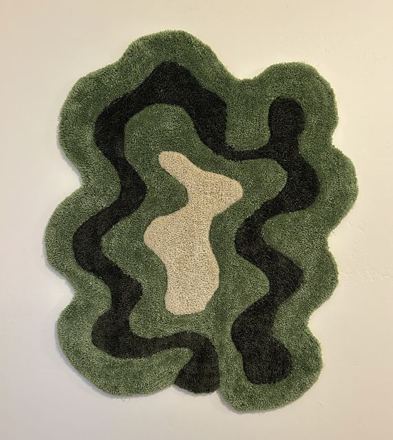 Hand-tufted rug in green topographic layers
