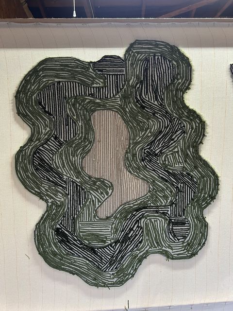 Back of the tufted rug showing the yarn loops